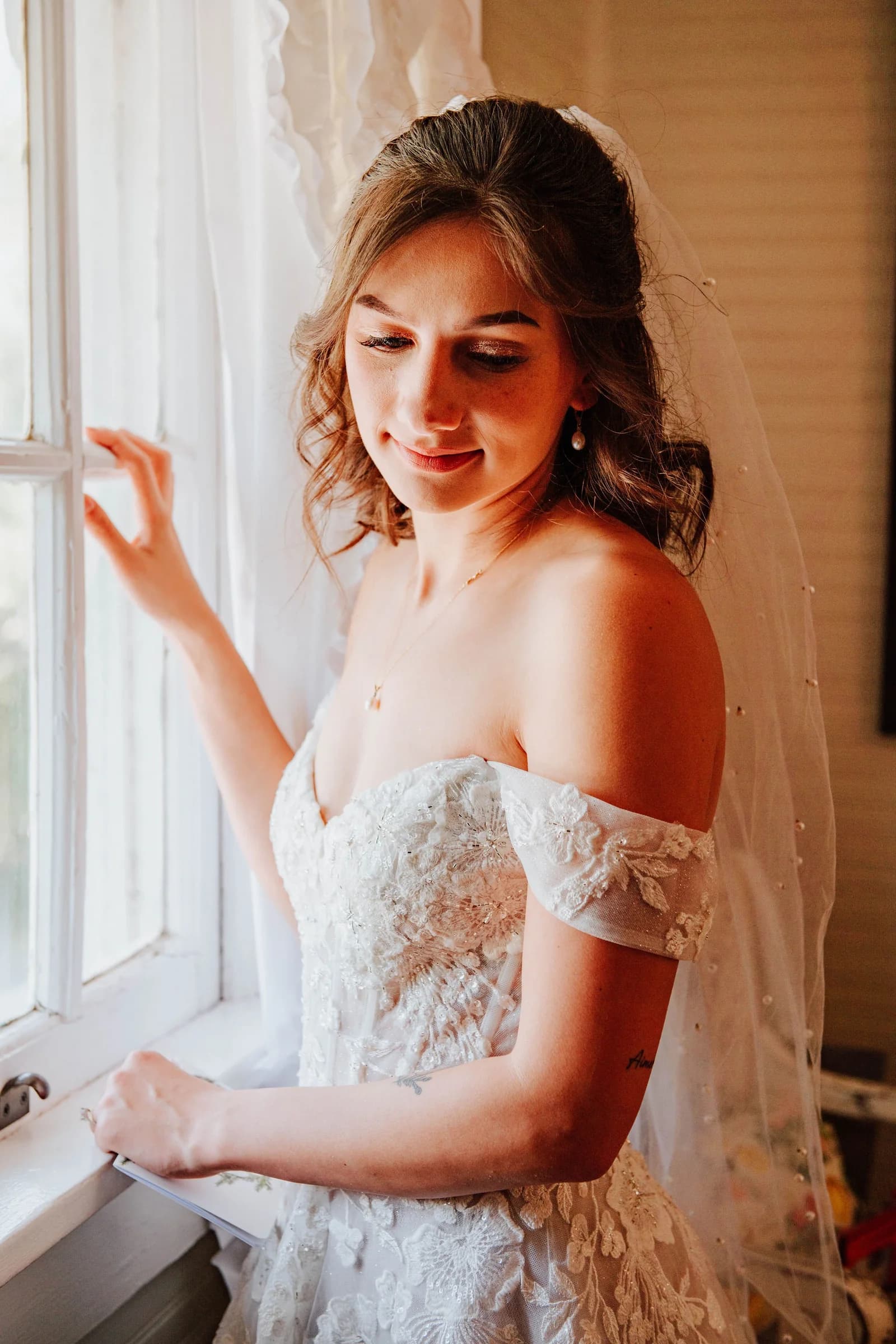 Bride seated with bouquet before the ceremony