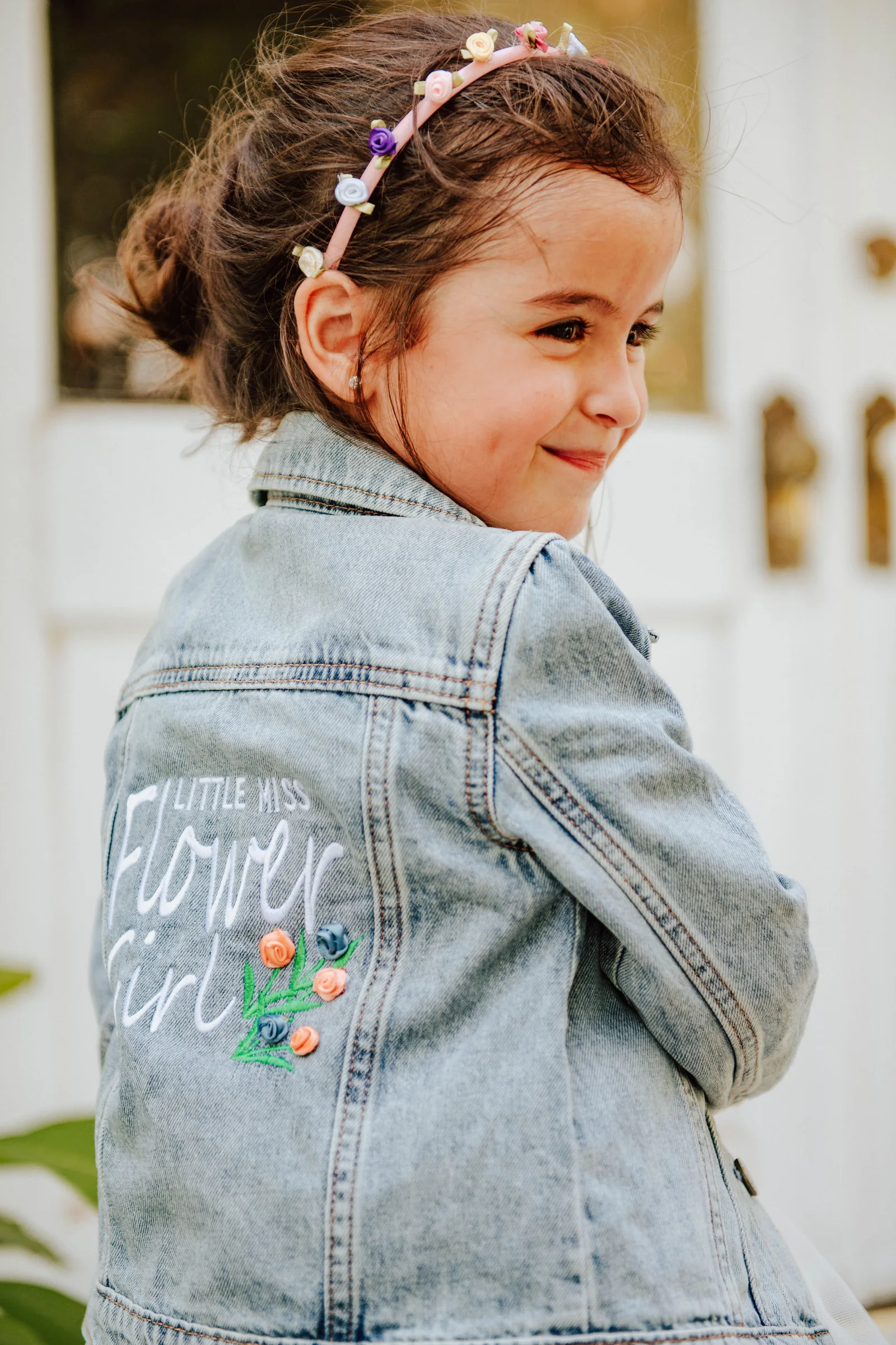 Ring bearer portrait in a light gray suit